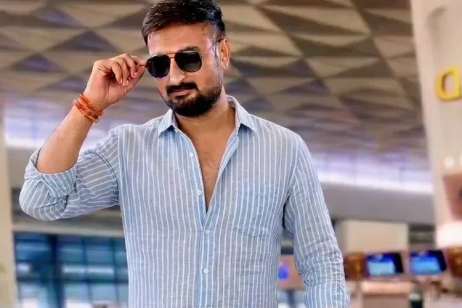 Male creator beginning a personally hosted Ujjain spiritual transformation journey with travel luggage
